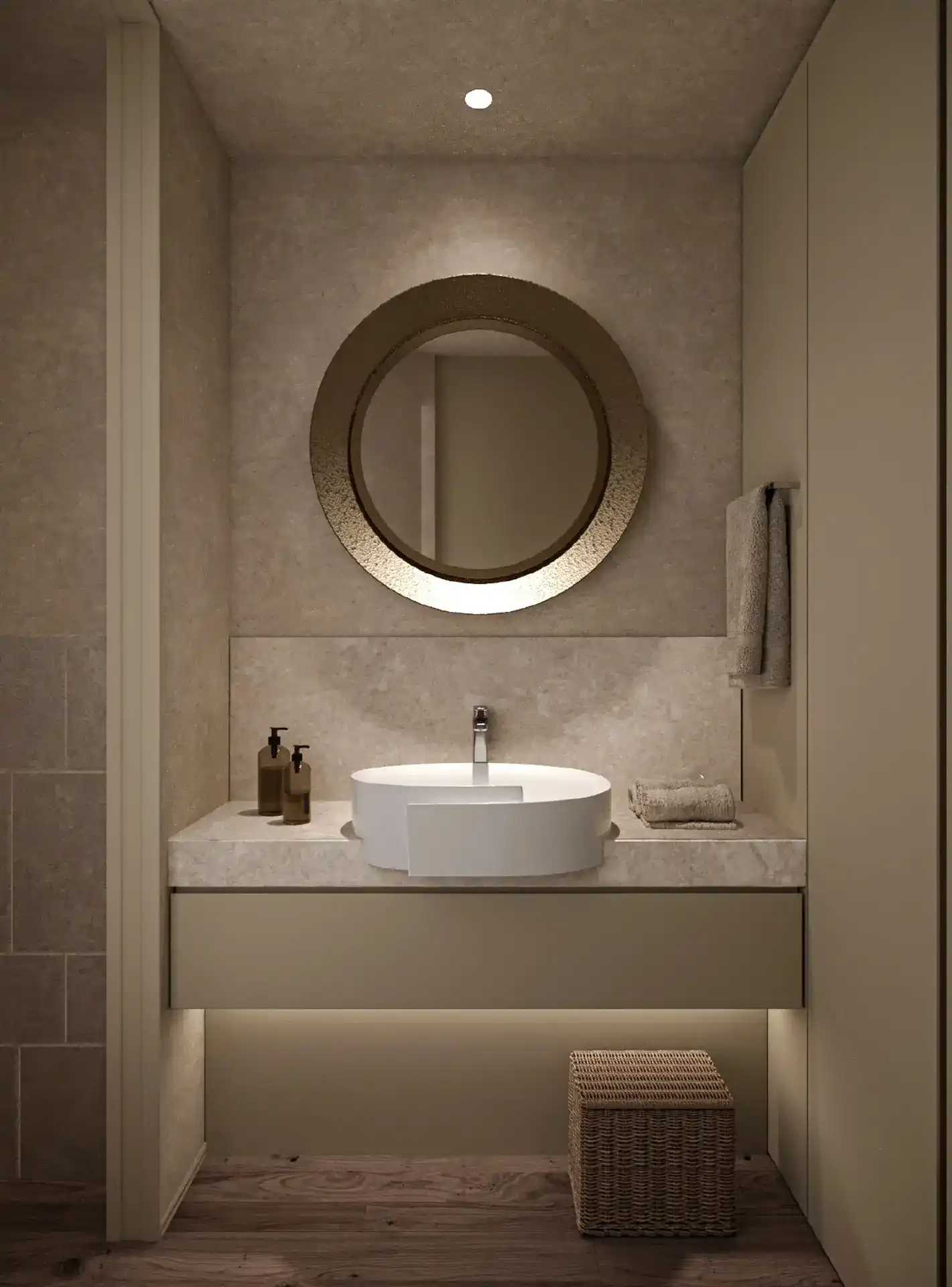 Bathroom vanity with a round mirror and stone surround